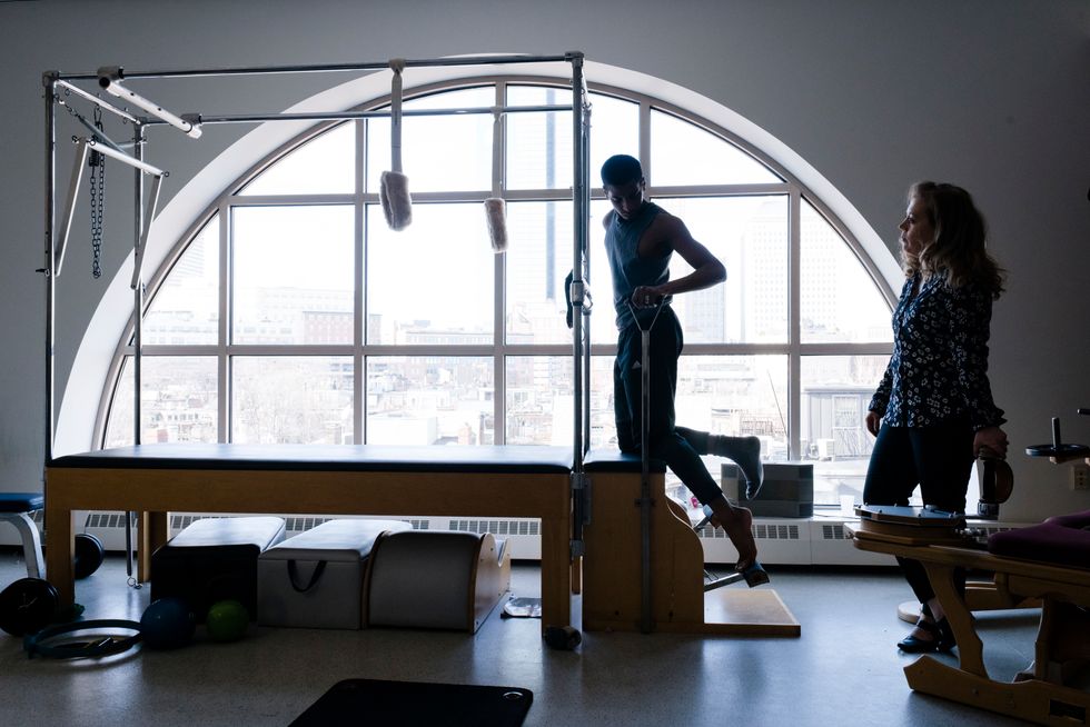 A dancer works out in Boston Ballet's Pilates room