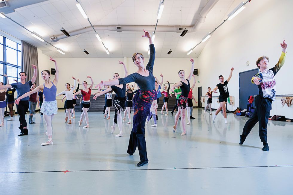 Patricia Barker demonstrates a tendu back in front of company class.