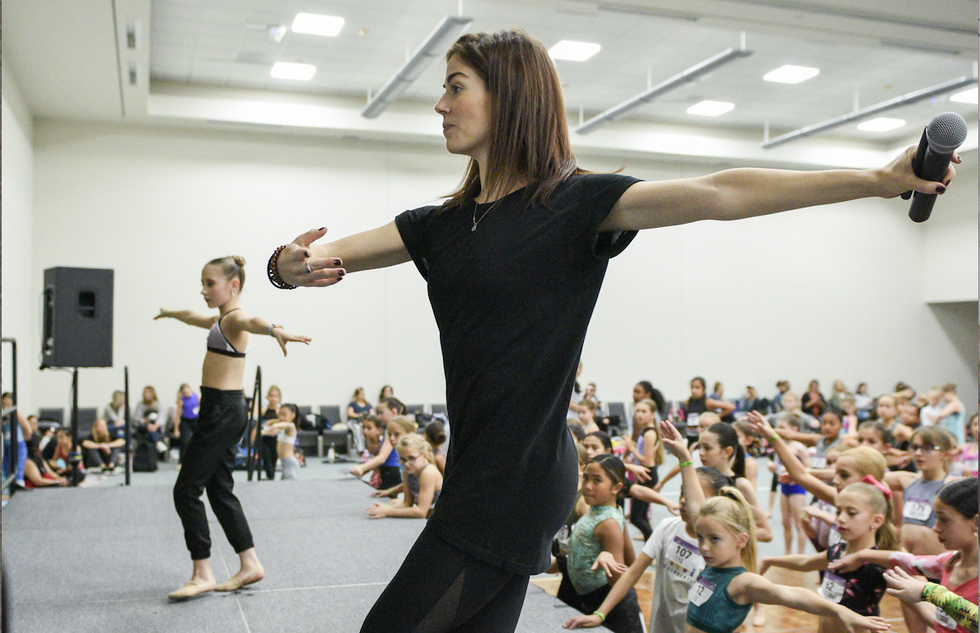 Kayle Kalbfleisch demonstrates to a room full of students