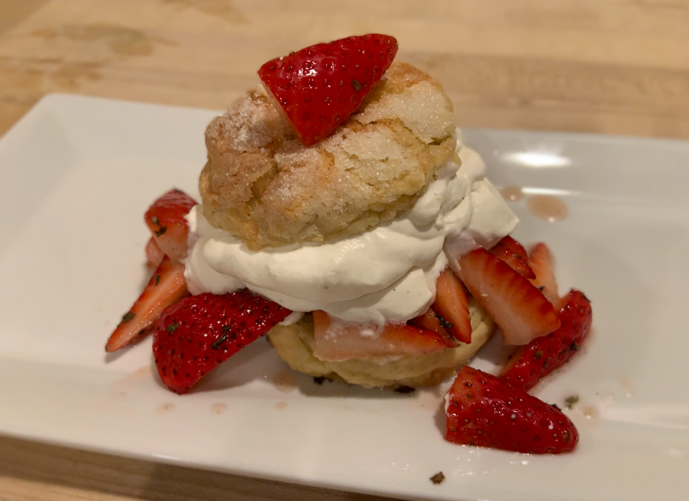 Close-up of a strawberry shortcake with whipped cream and stranberries
