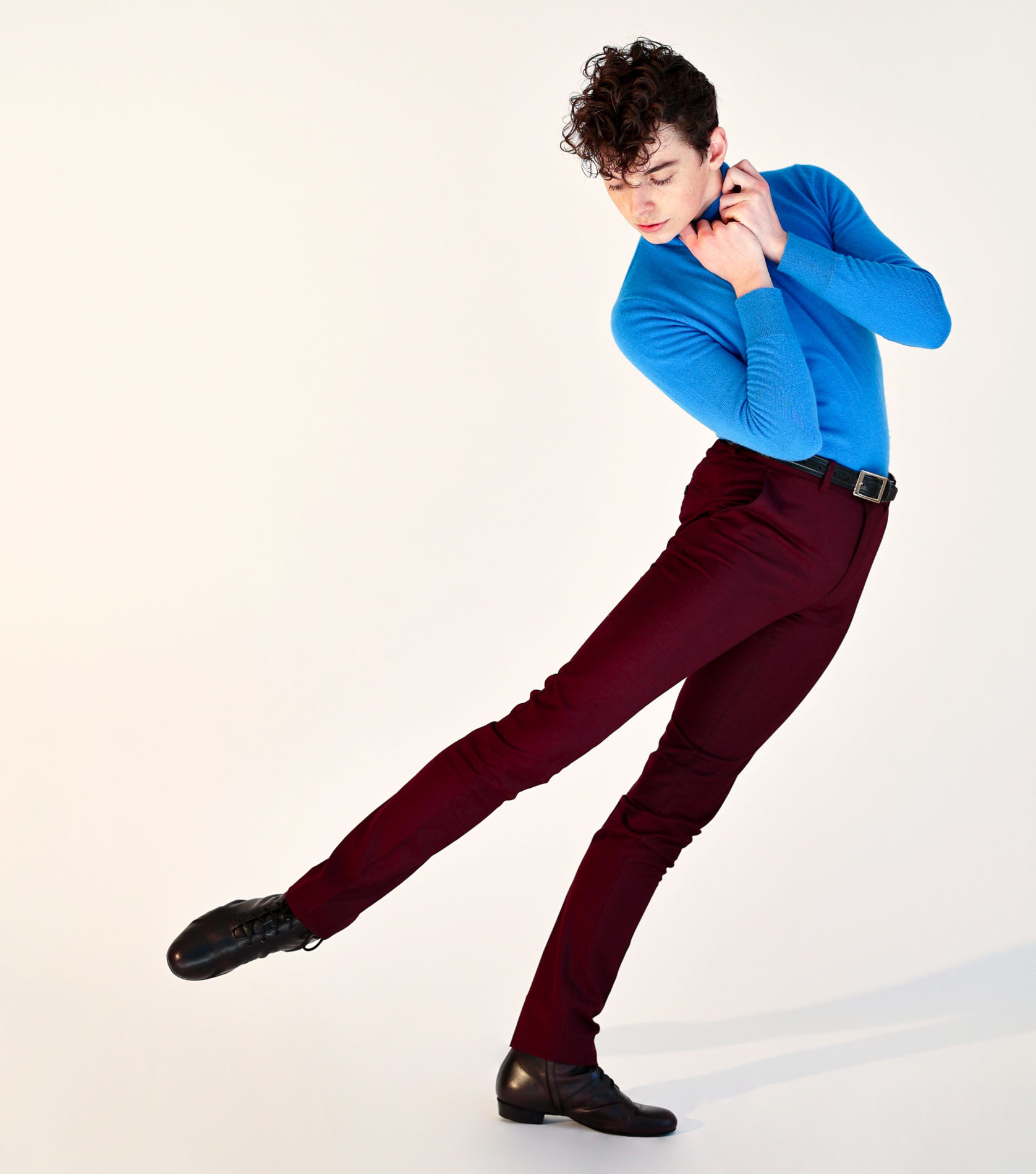 dancer wearing blue shirt and black pants