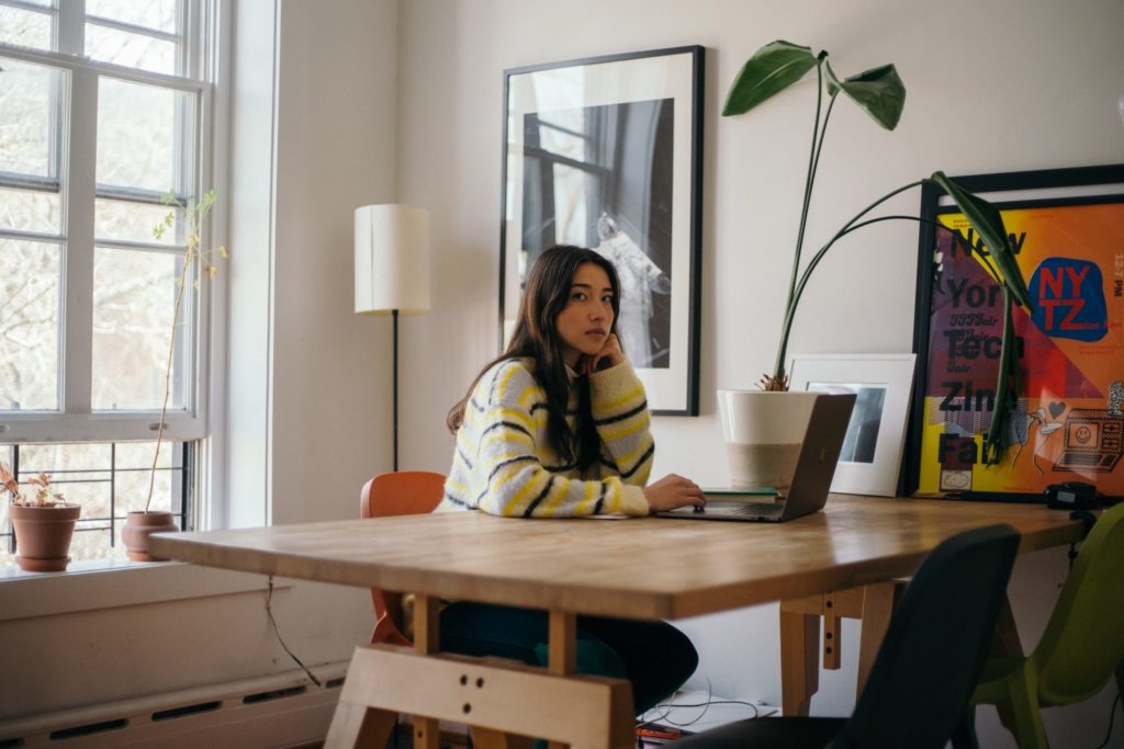 Maya Man glances up from her laptop. She sits in a sunny, artfully minimalist kitchen, wearing an oversized sweater.