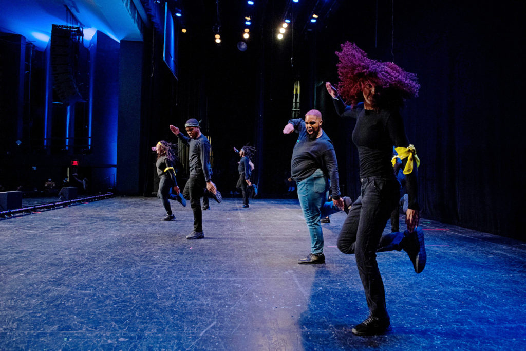 a group of dancers stepping on stage 