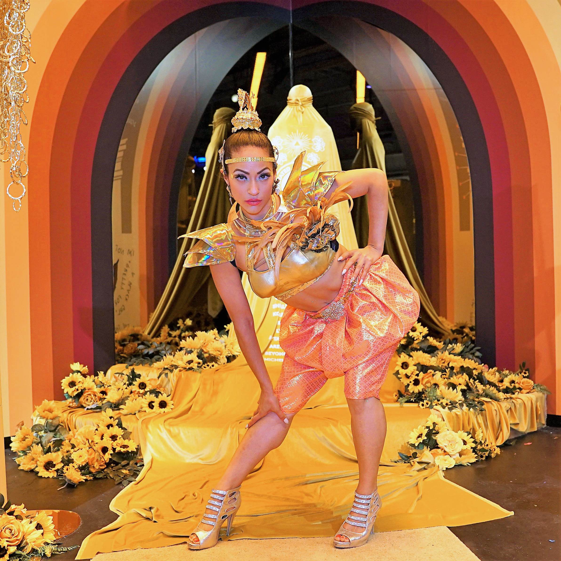 female dancer wearing shiny gold costume
