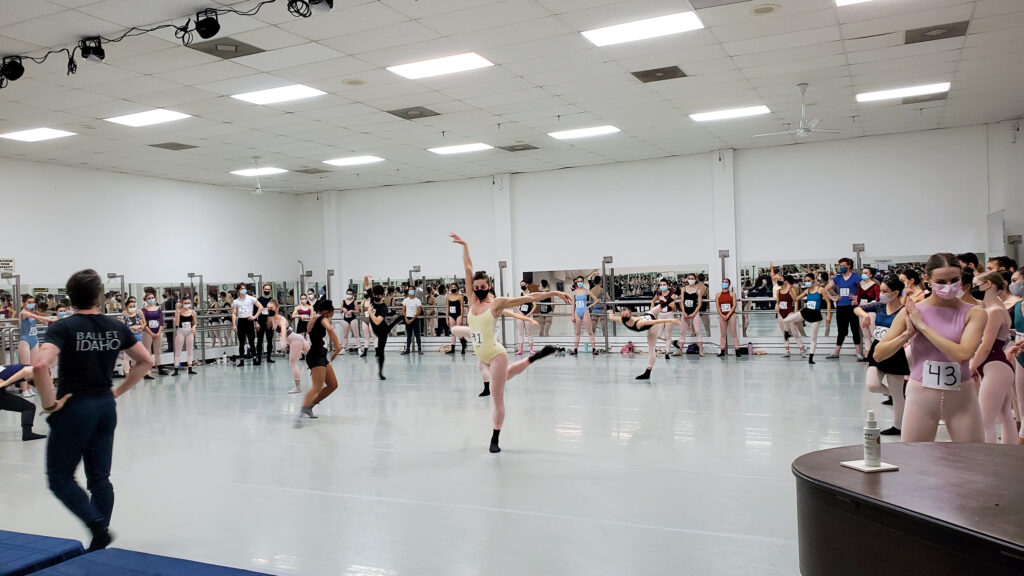 female dancers wearing tights and leotards dancing in a studio