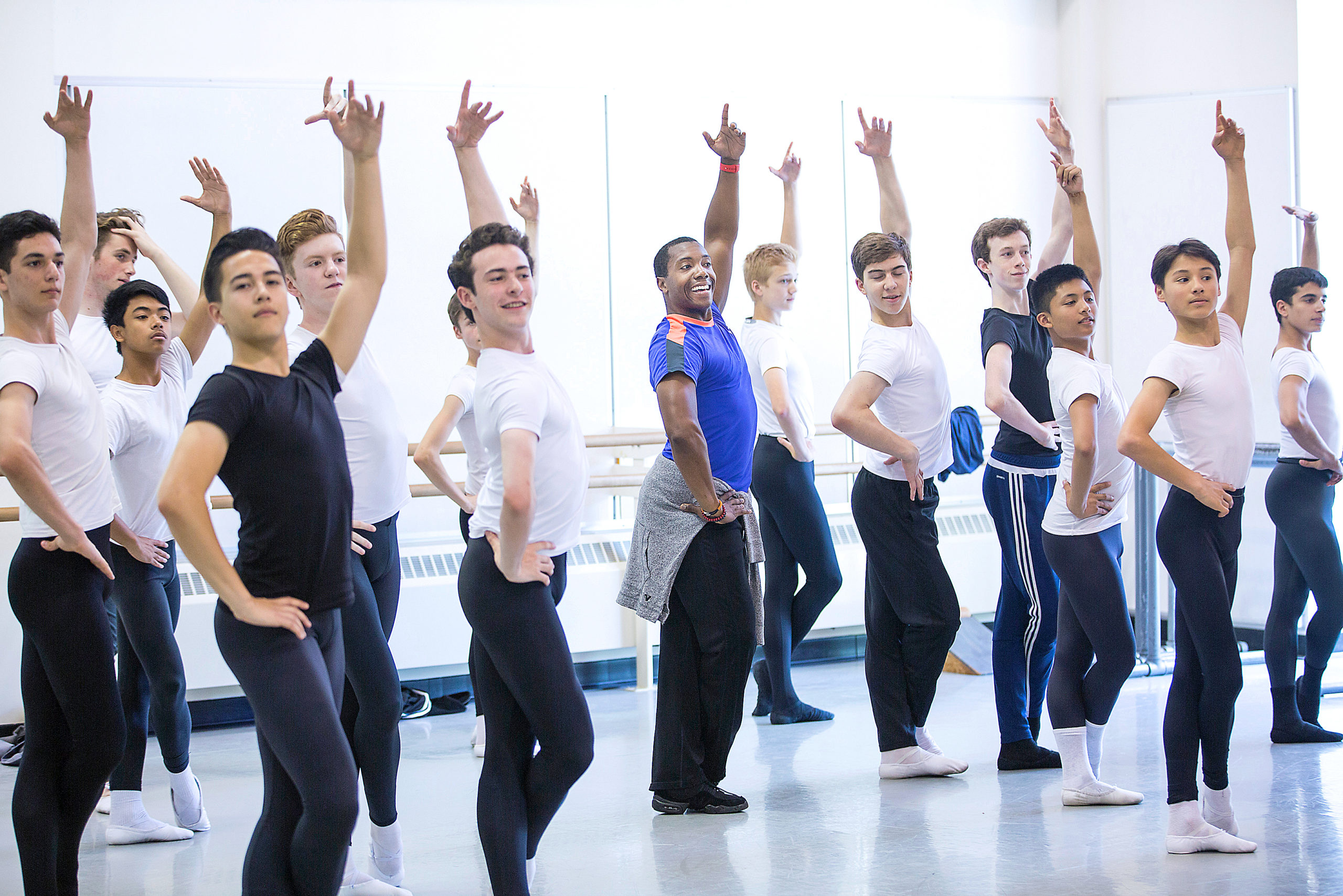 all male ballet class following teacher in center