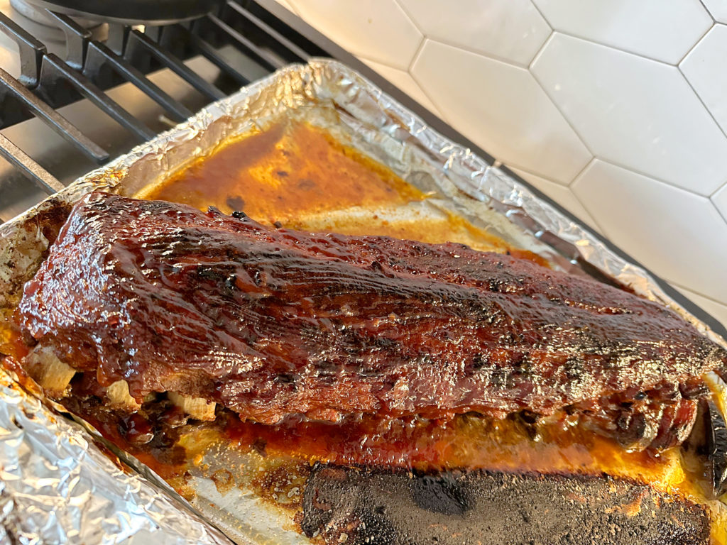 cooked ribs in a pan