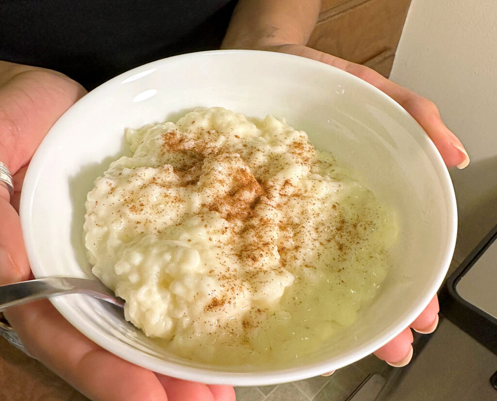 a white bowl with rice and cinnamon 