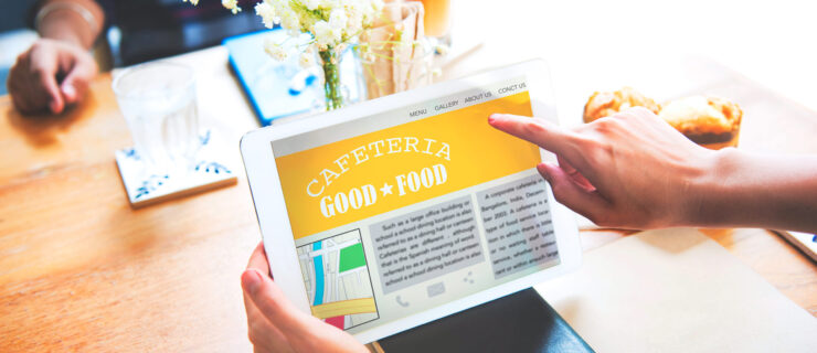 an iPad with a cafeteria good food article displayed