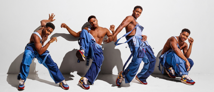 A series of four images of Ephraim Sykes, an athletic Black man in his 30s. He poses against an off-white wall, variously leaning against it in counterbalance or creating dramatic shadows. He wears denim overalls over a bare chest, letting one strap fall off his shoulder, and bright sneaks.