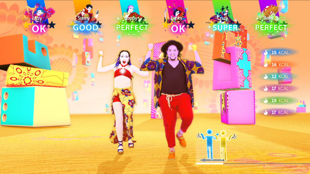 Two animated and brightly costumed dancers perform choreography in unison. Stick figure pictograms match their shapes in the bottom right corner of the screen. Feedback in the form of brightly colored words scroll across the top of the screen, reading: OK, GOOD, PERFECT, OK, SUPER, PERFECT.