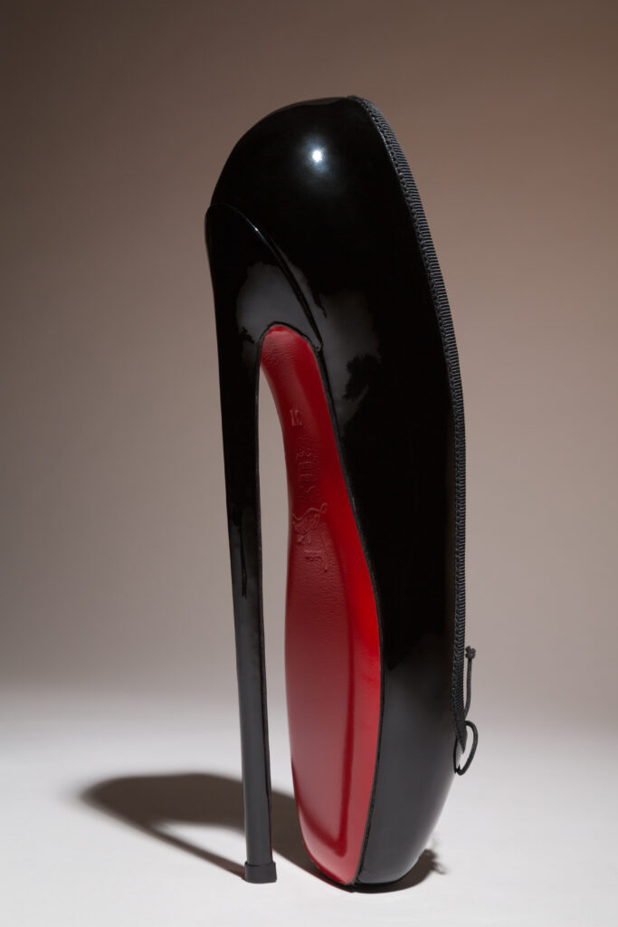 a black heel resembling and pointe shoe