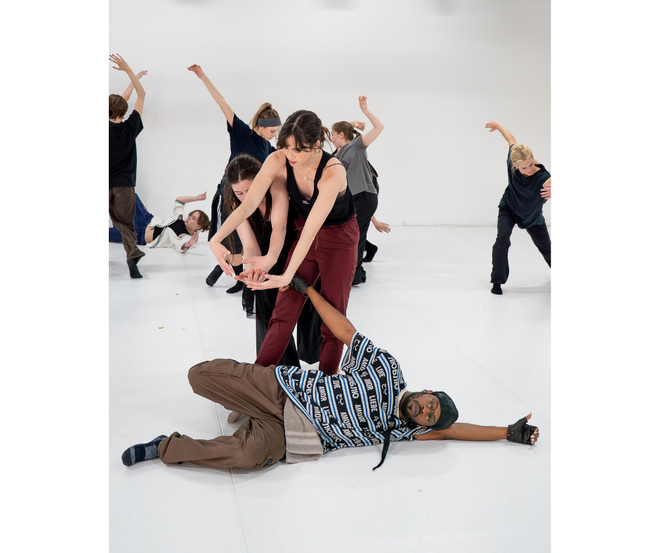 a group of dancers partnering each other in a large white room
